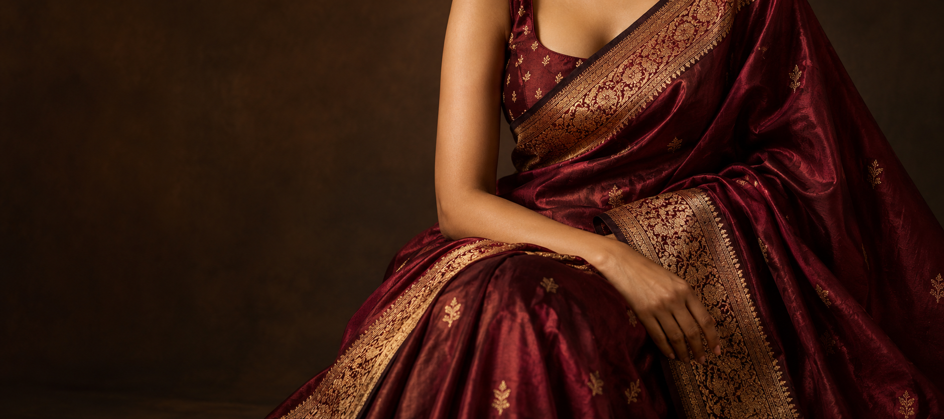Burgundy silk saree with an antique-gold border
